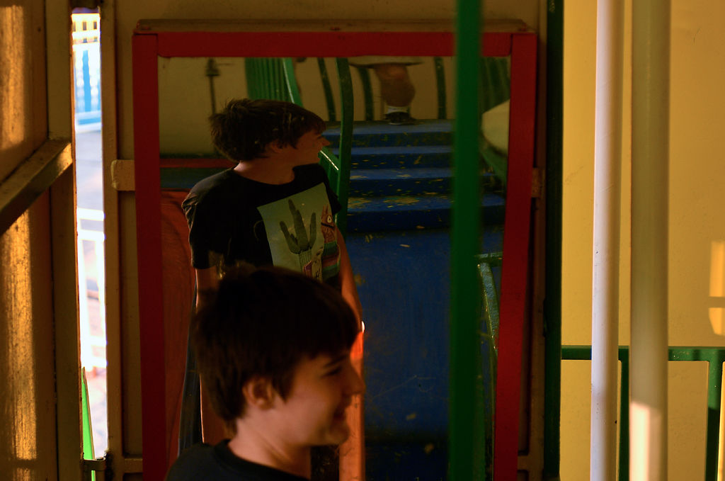 Liam Irvin, 13, plays with a distorting mirror inside a funhouse